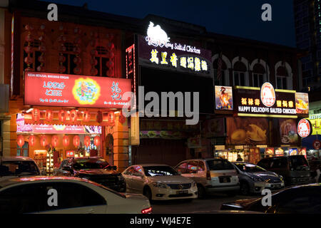 A night look at chicken resturants all lit up Chinatown in Ipoh, Malaysia. Stock Photo