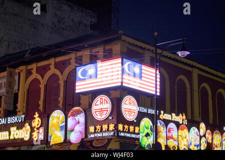 A night look at a Malaysian flag sign all lit up Chinatown in Ipoh, Malaysia. Stock Photo