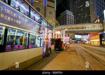 HONG KONG, CHINA - CIRCA JANUARY, 2019: double-decker buses seen in Hong Kong at night. Stock Photo