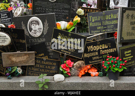 Communal grave of unclaimed ashes number one, where people executed by the NKVD were secretly buried from 1930 to 1942, at the Donskoye Cemetery in Moscow, Russia. It is believed the mass grave contains the remains of 4,259 victims of Stalin's regime. The plaques with the names were installed by the relatives since the 1980s. The plaques devoted to Red Army commanders Mikhail Tukhachevsky and Ieronim Uborevich executed in 1937 are seen in the picture among others. Stock Photo