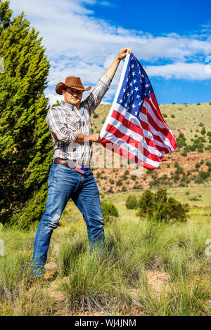 SOUTH WEST - A cowboy takes time to rest and reflect. Stock Photo