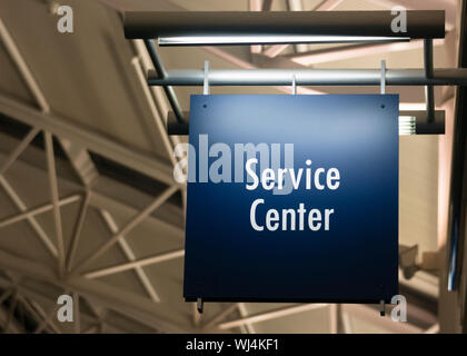 Blue Signage Marks the Customer Service Center in a Public Building ...