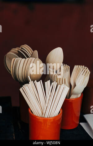 Bamboo fork, spoon and chopstick utensils in crocks Stock Photo