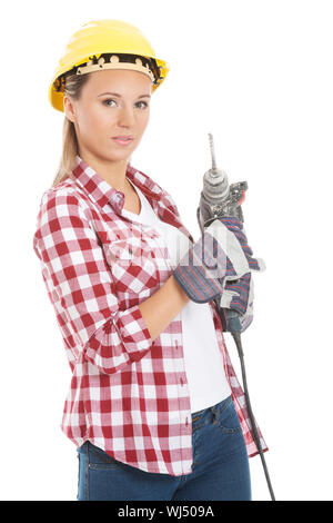 Young casual woman holding drill and wearing safety helmet. Isolated on white. Stock Photo