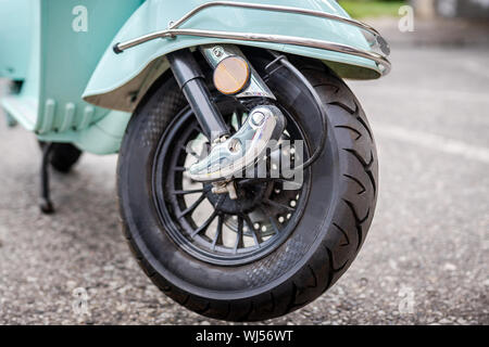 Front wheel of electric motorbike scooter. Stock Photo