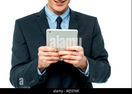 Corporate male operating touch pad device Stock Photo