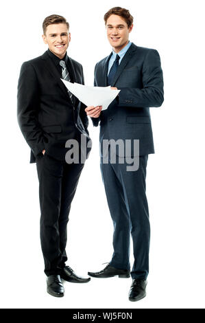 Business colleagues discussing a project plan Stock Photo