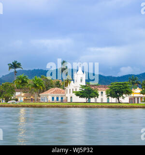 Paraty (or Parati) is a preserved Portuguese colonial (1500–1822) and Brazilian Imperial (1822–1889) town.  It is located on the Costa Verde (Green Co Stock Photo