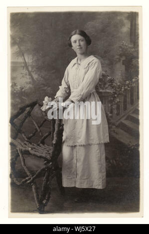 Early 1900's WW1 era studio portrait postcard of young woman from studio of Horace Dudley, W. Midlands, England, U.K. circa 1916,1917