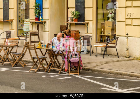 BRATISLAVA, SLOVAKIA - AUGUST 26, 2019:  tourists having meal in Bratislava, capital of Slovakia Stock Photo