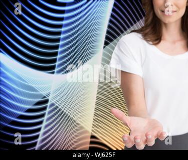 Composite image of businesswoman presenting her empty hand on abstract black background Stock Photo