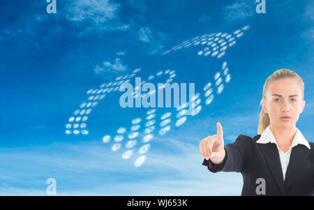 Composite image of blonde businesswoman pointing somewhere Stock Photo