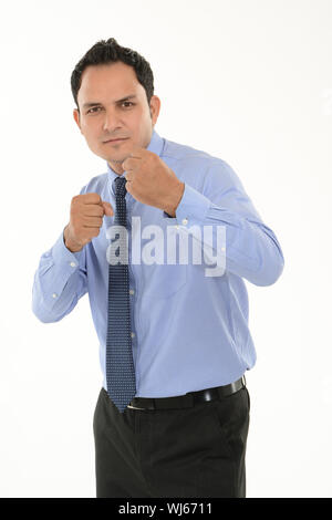 Young businessman in defensive pose afraid of something isolated on ...