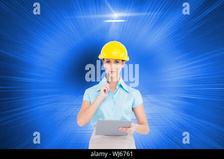 Composite image of thoughtful attractive architect on white background holding clipboard Stock Photo