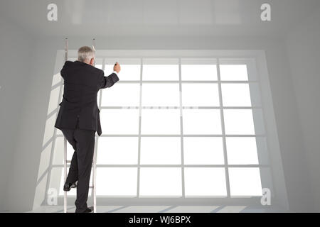 Composite image of mature businessman climbing career ladder Stock Photo