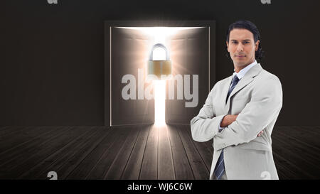 Composite image of portrait of a serious office worker posing with the arms crossed Stock Photo