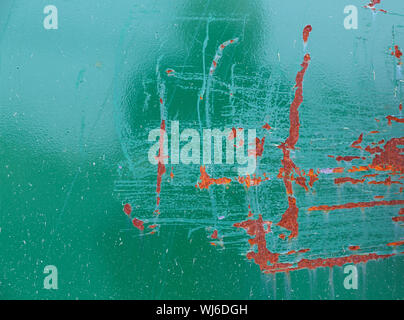 Close view of rusty painted green metal siding with large scratches. Stock Photo