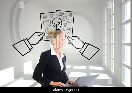 Composite image of blonde businesswoman using laptop Stock Photo