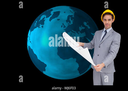 Composite image of serious architect with hard hat holding plans Stock Photo