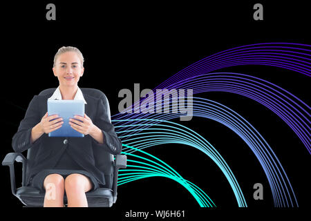 Composite image of blonde businesswoman sitting on swivel chair with tablet Stock Photo