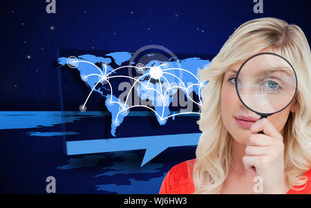 Composite image of fair-haired woman looking through a magnifying glass against a white background Stock Photo