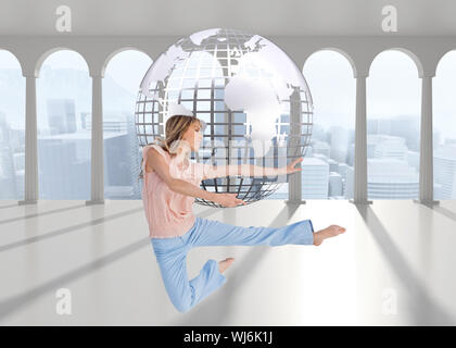 Composite image of woman doing dance pose Stock Photo