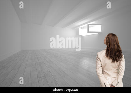 Composite image of rear view of businesswoman looking away Stock Photo