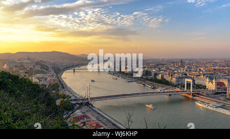 Budapest at golden hour with the Elisabeth Bridge in the foreground as it spans the Danube Stock Photo