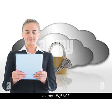 Composite image of blonde businesswoman holding tablet Stock Photo