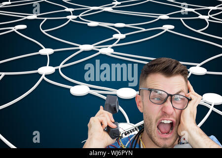 Composite image of portrait of frustrated computer engineer screaming while on call in front of open cpu Stock Photo