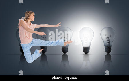 Composite image of woman doing dance pose on white background Stock Photo