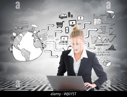 Composite image of blonde businesswoman using laptop Stock Photo