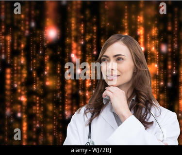 Composite image of thoughtful brunette doctor looking away Stock Photo