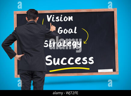 Composite image of asian businessman pointing Stock Photo