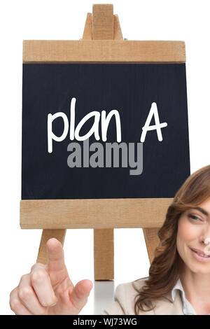 Composite image of businesswoman touching invisible screen against white background Stock Photo