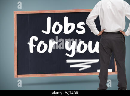 Composite image of rear view of classy young businessman posing Stock Photo