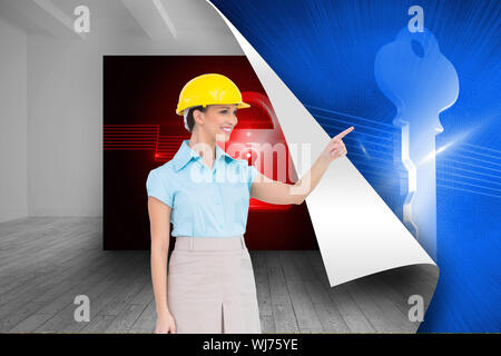 Composite image of smiling attractive architect pointing Stock Photo