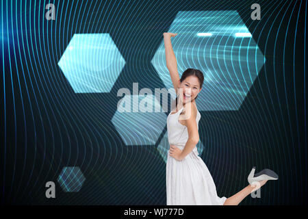 Composite image of happy and classy brunette posing Stock Photo