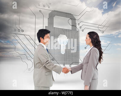 Composite image of side view of hand shaking trading partners against a white background Stock Photo