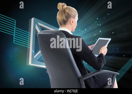 Composite image of blonde businesswoman sitting on swivel chair with tablet Stock Photo
