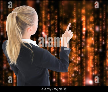 Composite image of blonde businesswoman pointing somewhere Stock Photo
