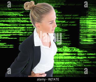 Composite image of blonde businesswoman standing with hands on hips Stock Photo