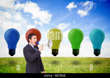 Composite image of standing businessman shouting through a megaphone agaisnt white Stock Photo