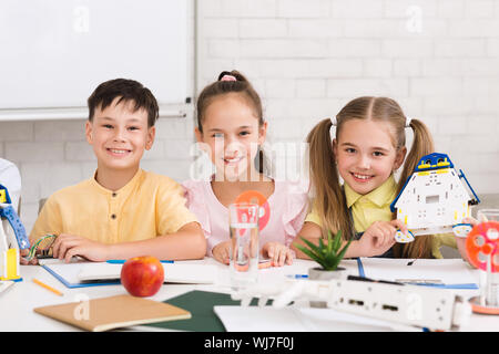 Pupils building robots in after school stem class Stock Photo