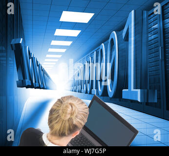 Composite image of blonde businesswoman using laptop Stock Photo