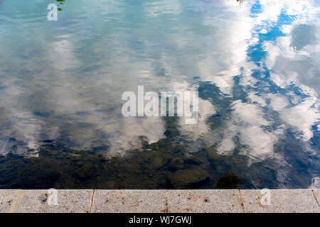 Sky reflecting on dark, almost still water, Marne River, Nogent-sur-Marne, France Stock Photo