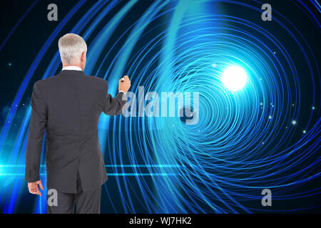 Composite image of rear view of businessman standing and writing on white background Stock Photo