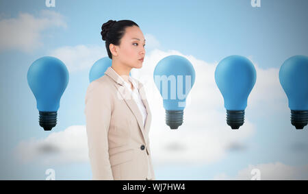 Composite image of unsmiling asian businesswoman Stock Photo