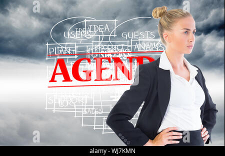 Composite image of blonde businesswoman standing with hands on hips Stock Photo