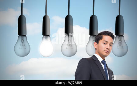 Composite image of five light bulbs in row sky background Stock Photo